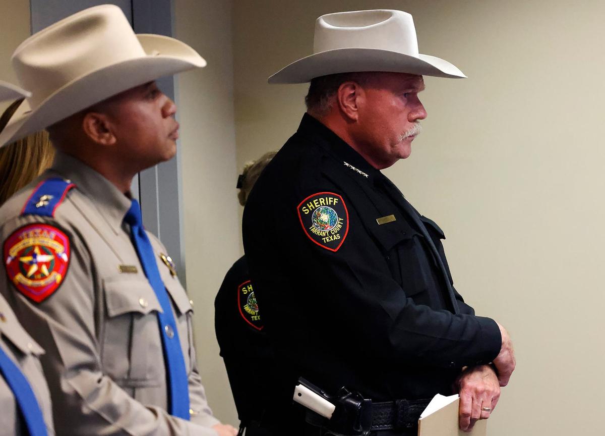 Tarrant County Sheriff Bill Waybourn, right, and Texas Public Safety Regional Director Jeremy Sherrod stand by while the media is shown the video of events leading up to Anthony Johnson Jr.’s death while in custody. Two employees were fired after one put his weight on Johnson’s back.