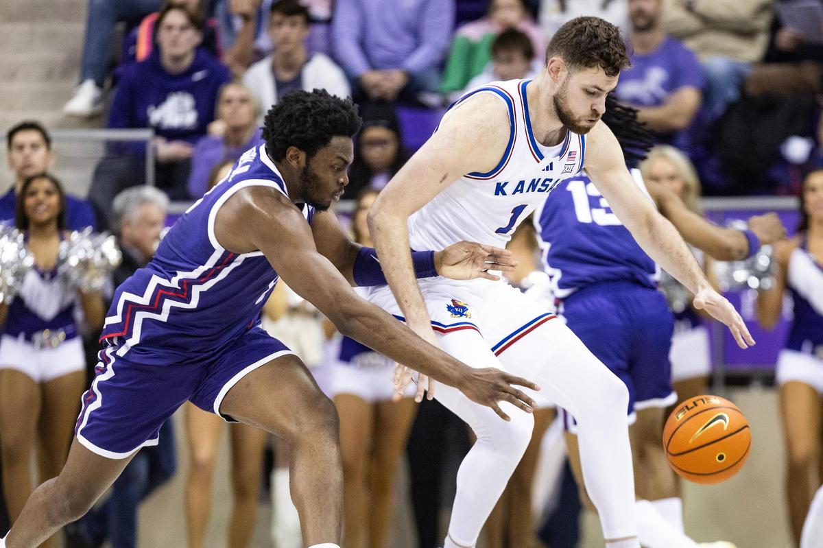 TCU center Ernest Udeh Jr. (8) knocks the ball away from Kansas center Hunter Dickinson (1) in the first half of an NCAA game between TCU and Kansas at Schollmaier Arena in Fort Worth on Wednesday, Jan. 22, 2025.