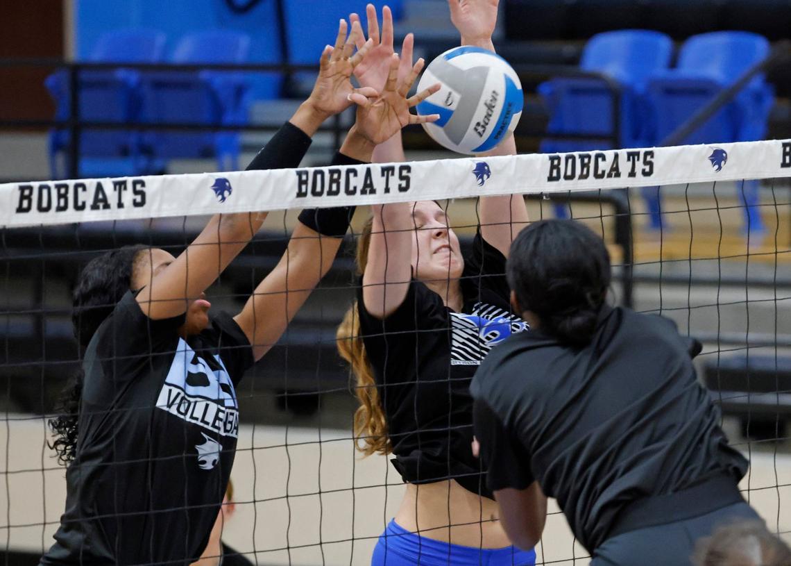 Zion Coats and Kylie Kleckner attempt to block a shot during volleyball practice at Byron Nelson High School in Trophy Club Texas, Wednesday, Sept. 25, 2024.