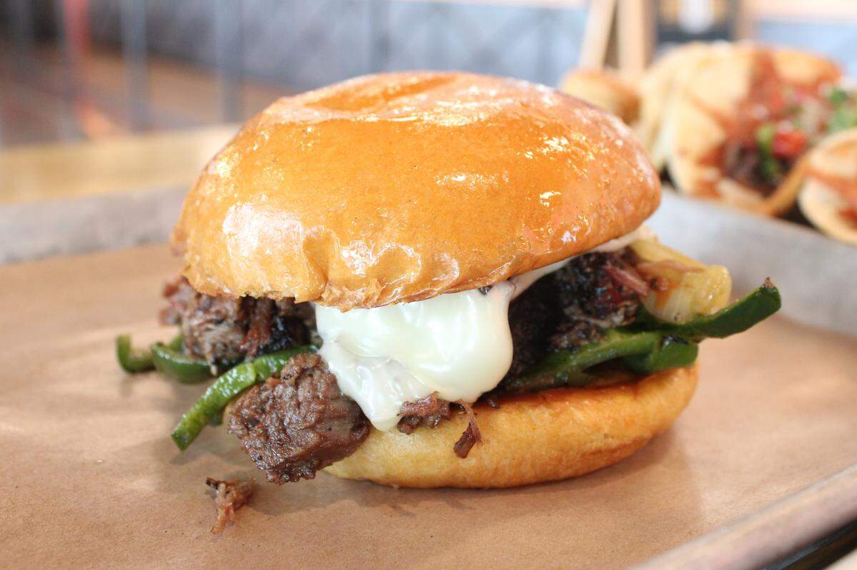 Prime Brisket Philly, a specialty at Loop 9 BBQ in Grand Prairie, filled with brisket, poblano peppers, cheese and a bun glazed with beef tallow.