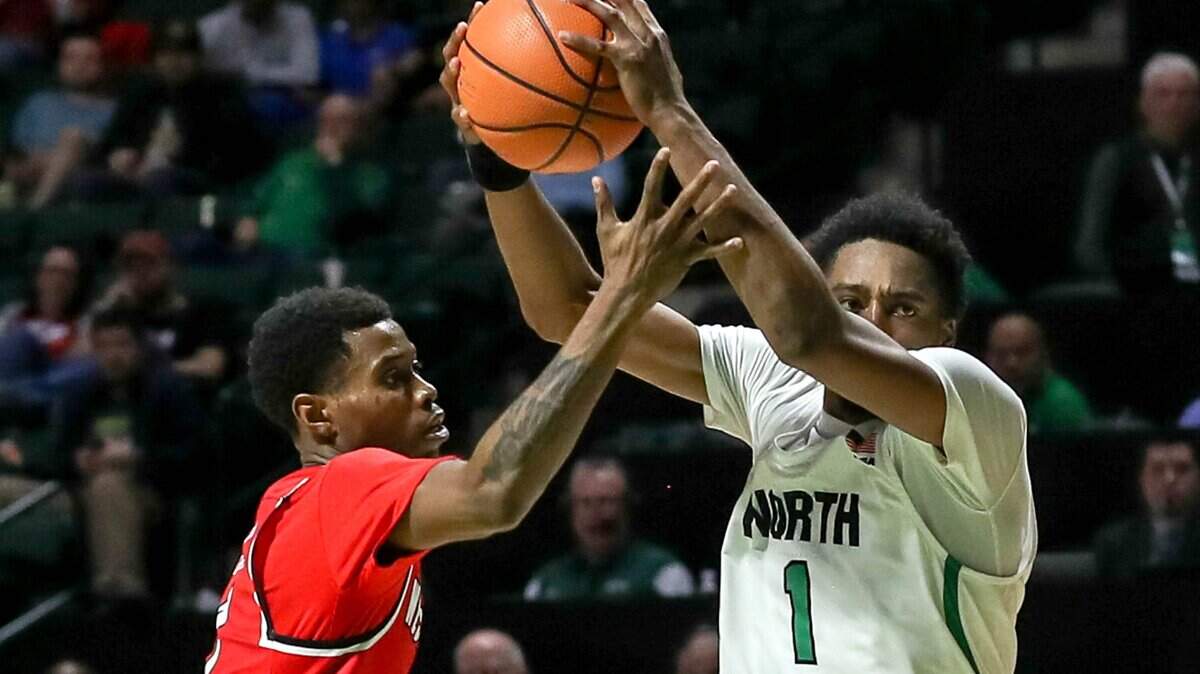 North Texas guard A.J. Lawson, at right in a game earlier this season against Western Kentucky, scored 12 points Friday night as the Mean Green defeated San Francisco to win the College Basketball Invitational tournament championship.