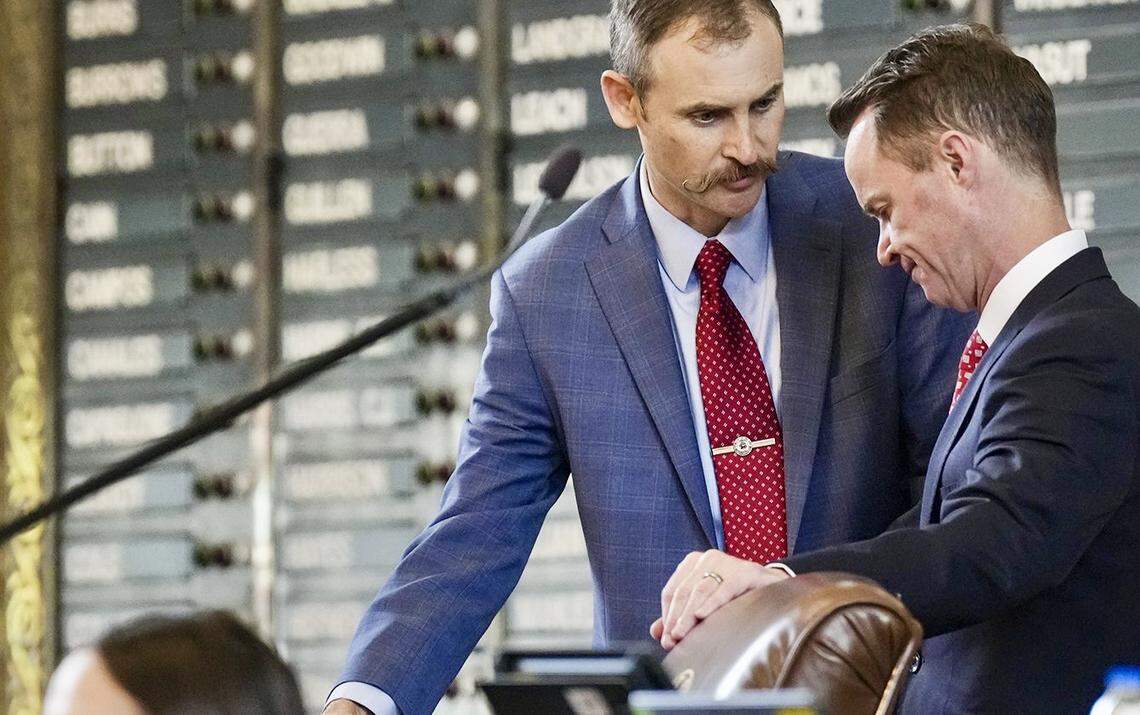 Rep. Andrew Murr, R-Junction, speaks with Rep. Dade Phelan, R-Beaumont, during Sine Die in the House of Representatives at the Texas Capitol on Monday, May 29, 2023.