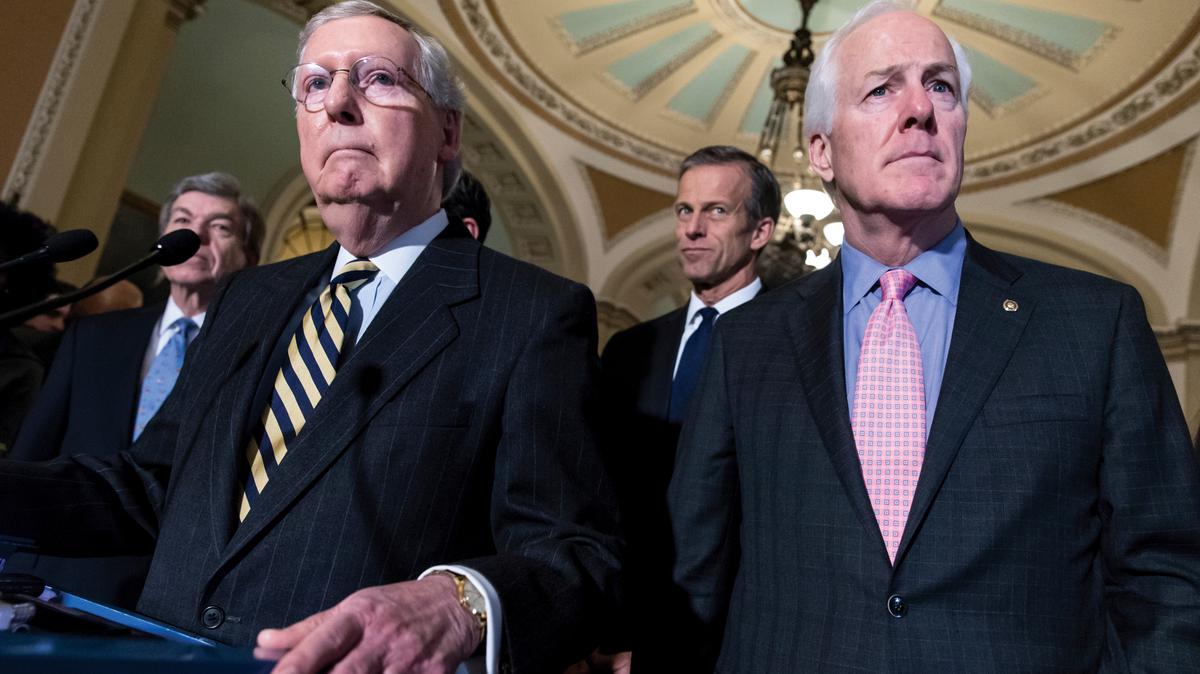 FILE - Sen. Mitch McConnell, R-Ky., left, and Sen. John Cornyn, R-Texas, right, talk to reporters following a closed-door policy meeting at the Capitol in Washington, Tuesday, March 8, 2016. In the aftermath of recent horrific mass shootings in Uvalde, Texas and Buffalo, New York, a bipartisan group of senators, including Cornyn and Sen. Chris Murphy, D-Conn., held private virtual meetings during recess to strike a compromise over gun safety legislation. (AP Photo/J. Scott Applewhite, File)