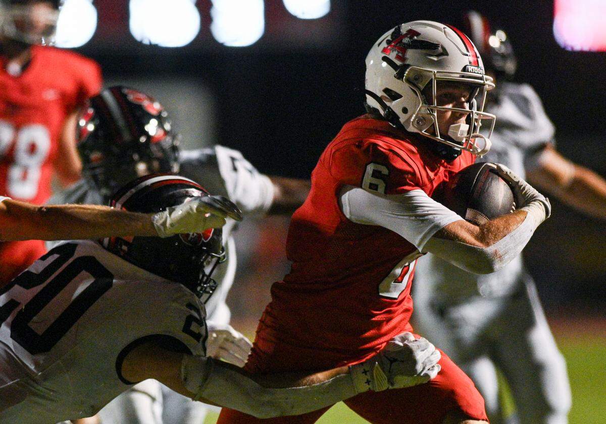 Argyle running back Watson Bell (6) powers through a tackle and heads towards the end zone during a UIL football game against Colleyville Heritage at Eagle Stadium in Argyle, Texas on Friday, Sept. 27, 2024.