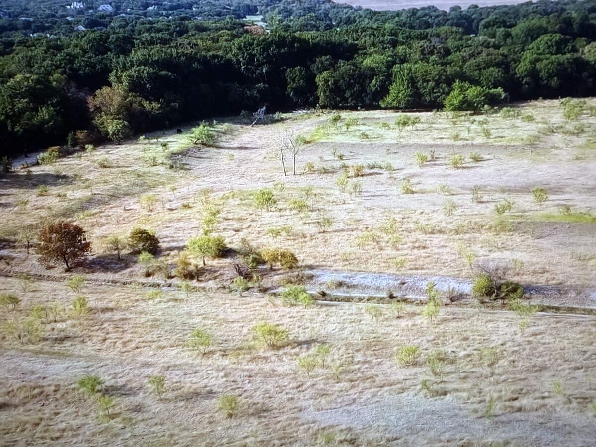 The Trinity Estates Phase III property in Benbrook. Sandlin Homes is developing the land, which lies between Timberline Dr. and the Clear Fork of the Trinity River. To do so, Sandlin is reclaiming a portion of the property from the Clear Fork’s floodplain, which worries some nearby residents.