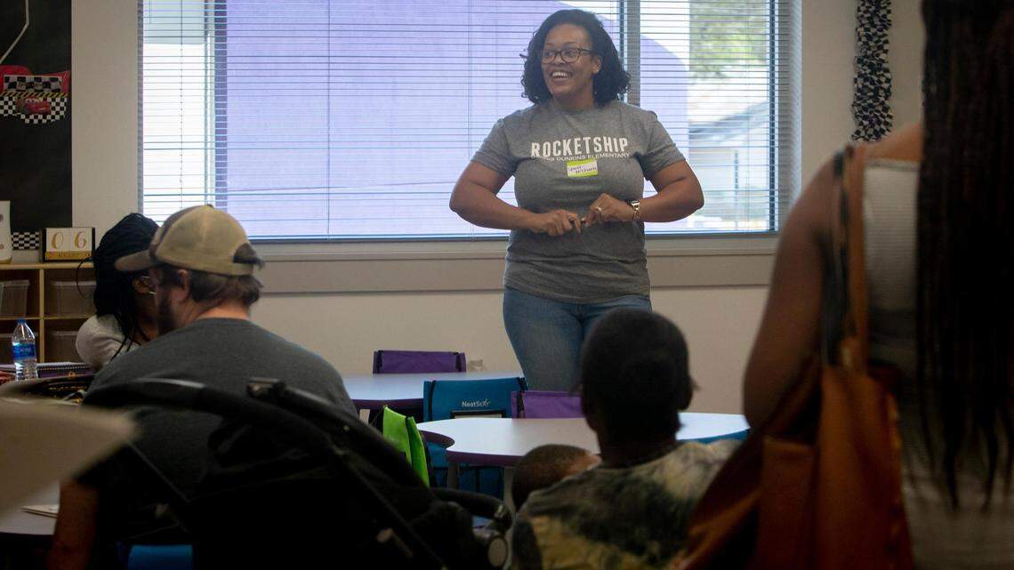 Ronica McQueen welcomes students and parents into her classroom at Rocketship Dennis Dunkins Elementary in Fort Worth, Texas, on Saturday, Aug. 6, 2022. The new charter school held a community kick-off event the weekend before school began Monday.