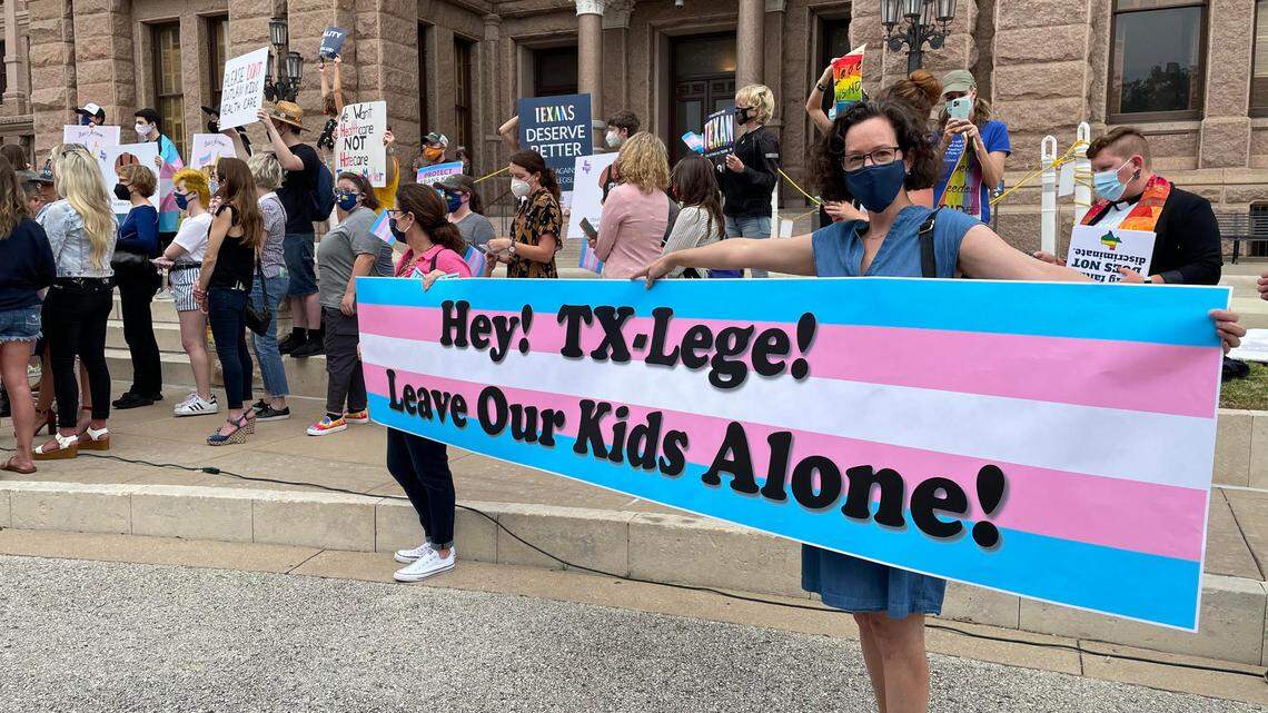 LGBTQ advocates protest legislation that impacts transgender kids at the Texas Capitol on April 28, 2021.