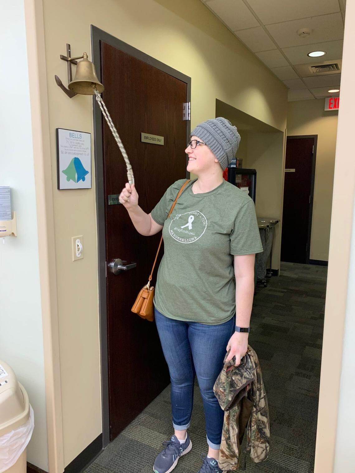 Abigail Phillips rings the bell after being declared cancer free and in remission in March 2020 after several months of chemotherapy.