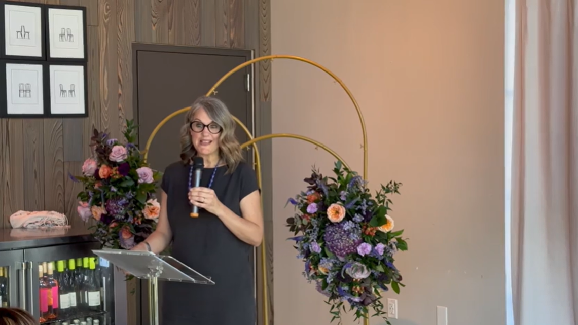 Kathryn Jacob, CEO of The Archway, announces the nonprofit’s new name to staff. The organization was previously known as SafeHaven.