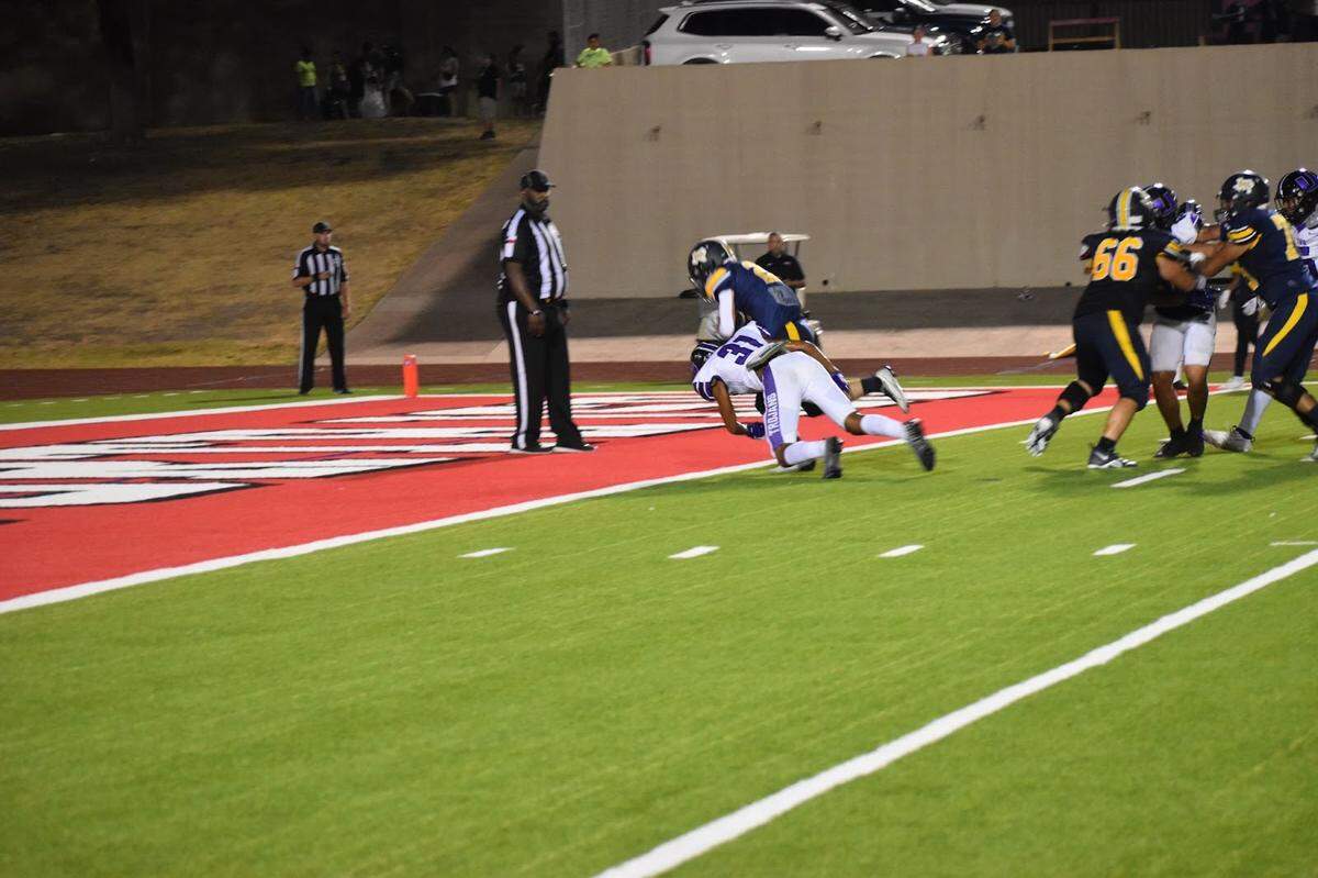 Hank Hayden (22) scores a touchdown for Arlington Heights during a high school football game against Waco University at Farrington Field in Fort Worth, Texas Thursday, September 7, 2023.