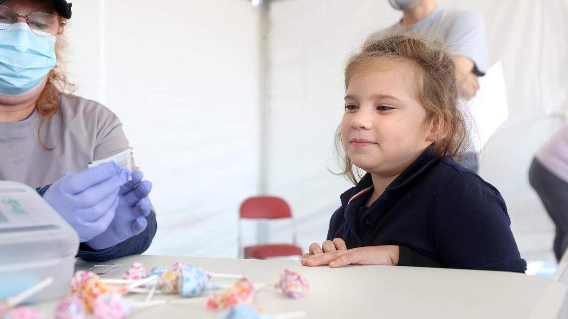Mia Ramirez, 6, waits to be vaccinated In November. Officials are urging parents with children 5 and older to get their children vaccinated, as the omicron variant is increasingly affecting kids who are too young to get the vaccine.
