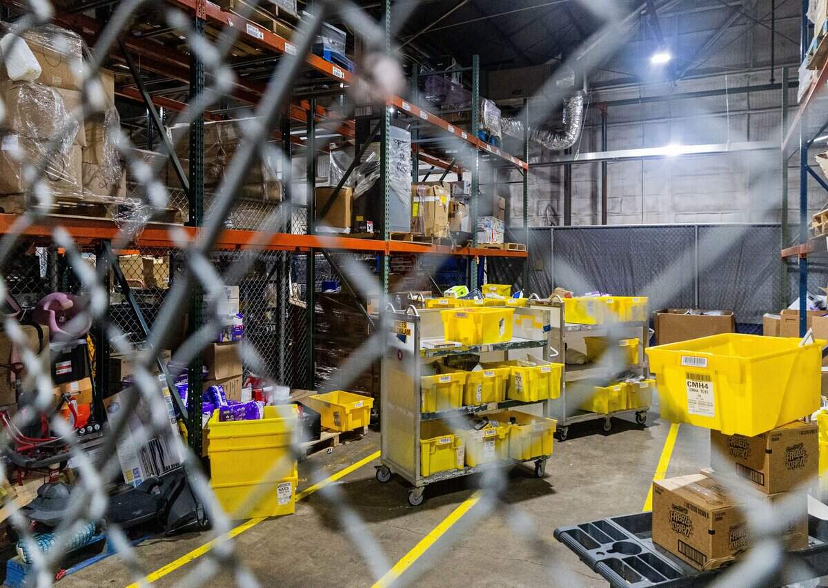 Containers and boxes full of goods sit in a warehouse at the Community Food Bank of Fort Worth on June 15, 2026. The Community Food Bank does not have any ZIP code restrictions.