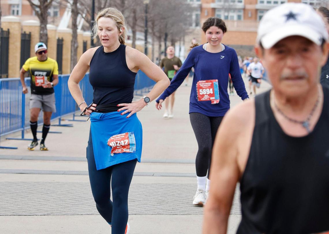 Fort Worth mayor Mattie Parker slows at the finish line to take a breath during the 2025 Cowtown at the Will Rogers Memorial Center in Fort Worth, Texas, Sunday, Feb. 23, 2025.