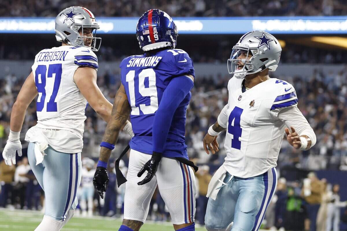 Nov 12, 2023; Arlington, Texas, USA; Dallas Cowboys quarterback Dak Prescott (4) reacts after scoring a touchdown in the second quarter against the New York Giants at AT&T Stadium. Mandatory Credit: Tim Heitman-USA TODAY Sports