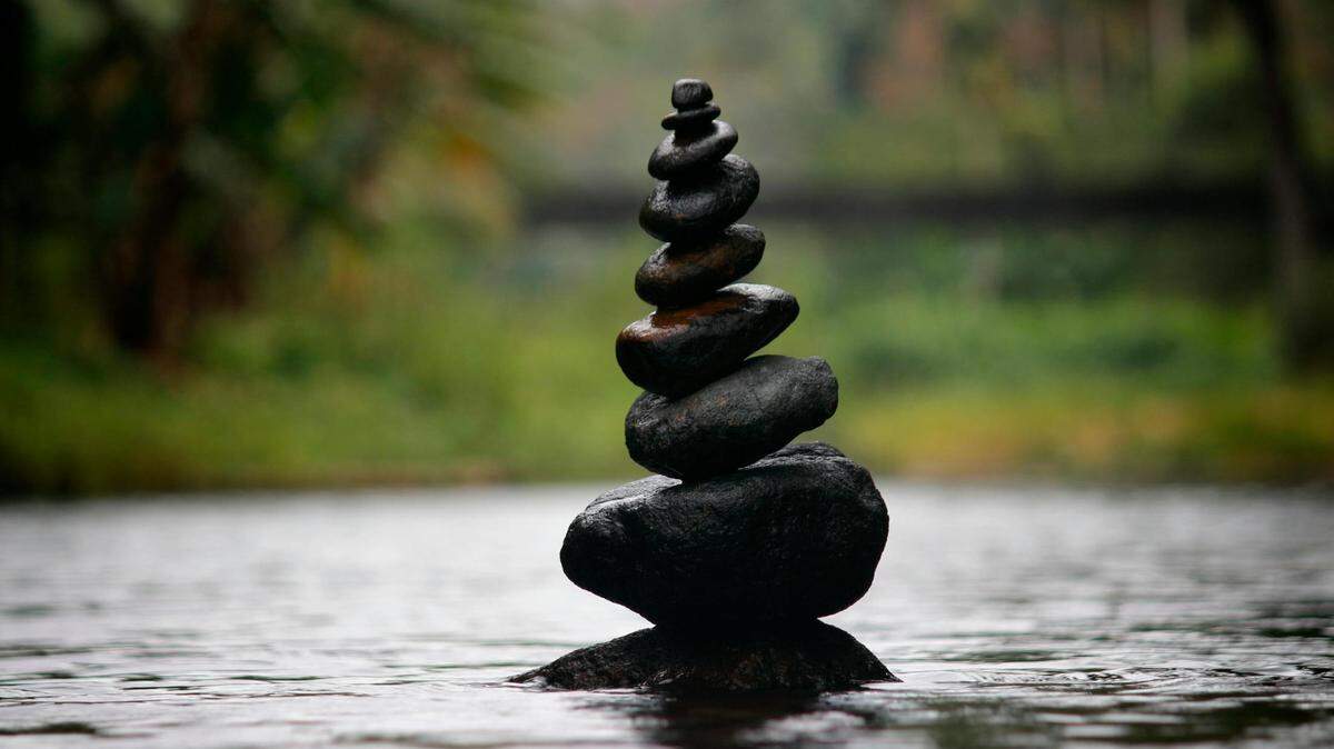 Black stackable stones at the Body of Water