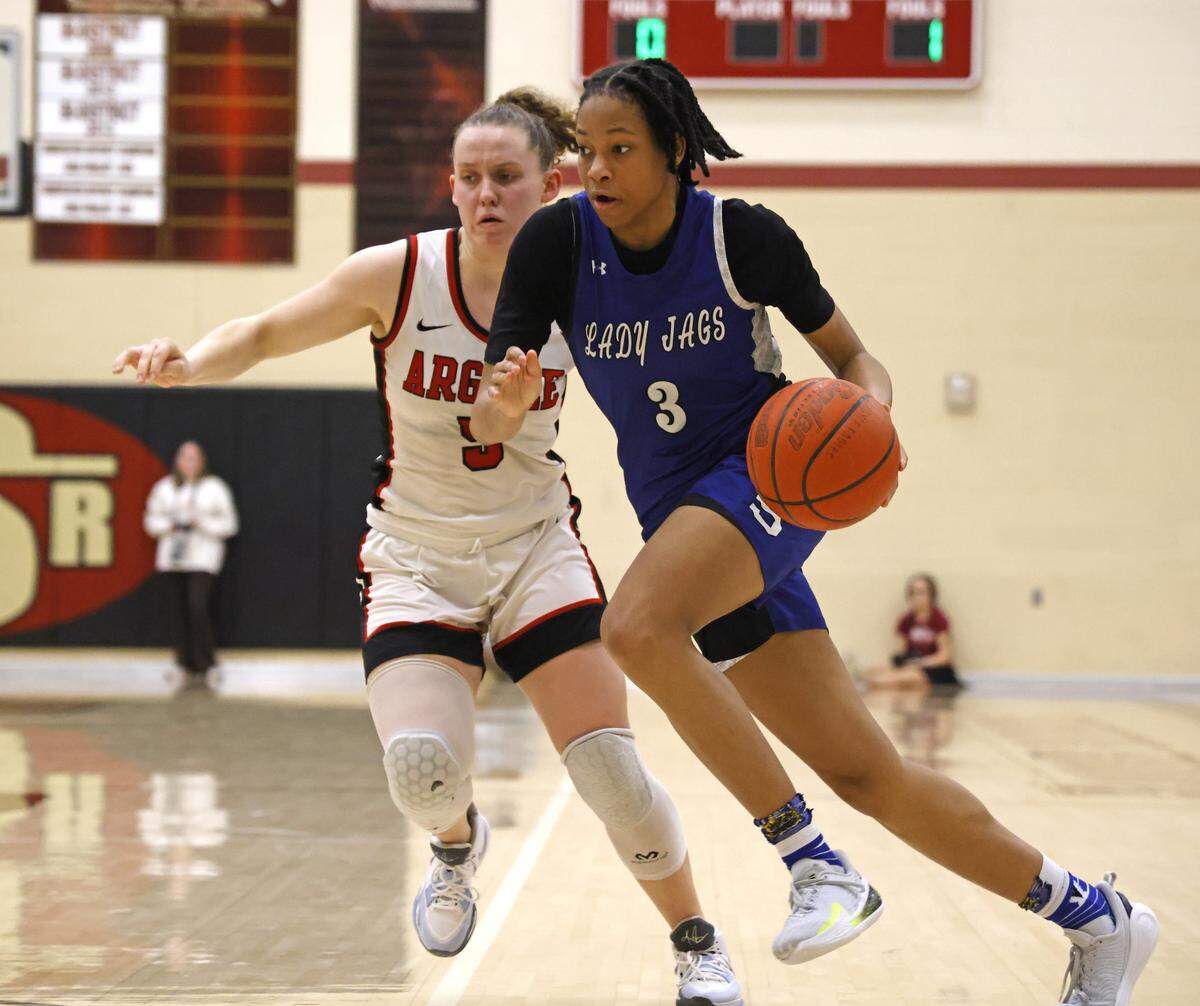 Mansfield Summit guard Kyndal Hardaway (3) crosses in front of Argyle guard Wrigley Green (5) during the second half of a UIL Class 5A DII girls playoff basketball game at Saginaw High School in Saginaw, Texas, Thursday Feb. 19, 2026.