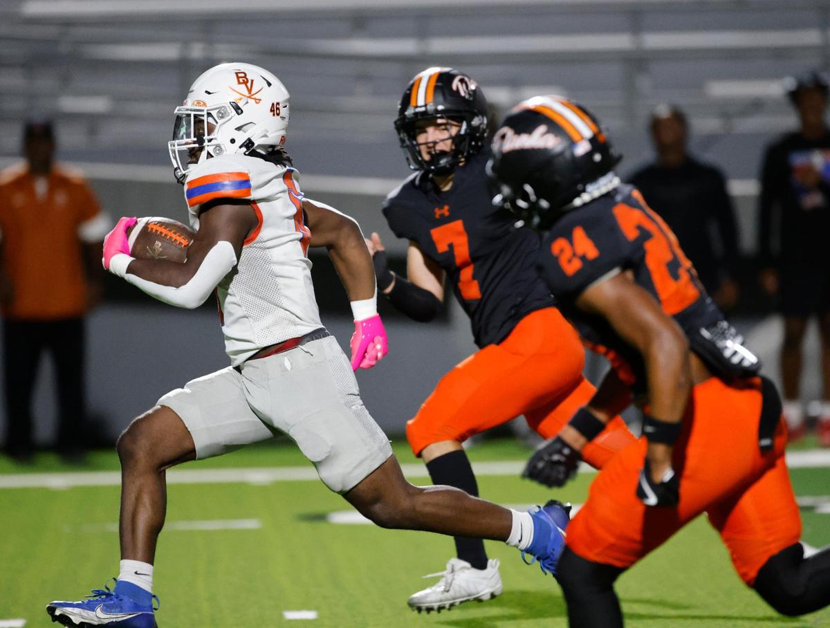 Bowie running back Darrion Bowers (6) outruns Haltom defensive back Brian Connors (7) and Andre Rich (24) to the end zone during a District 8-6A football game at Birdville Fine Arts/Activity Complex in North Richland Hills, Texas, Friday, Oct. 25, 2024.