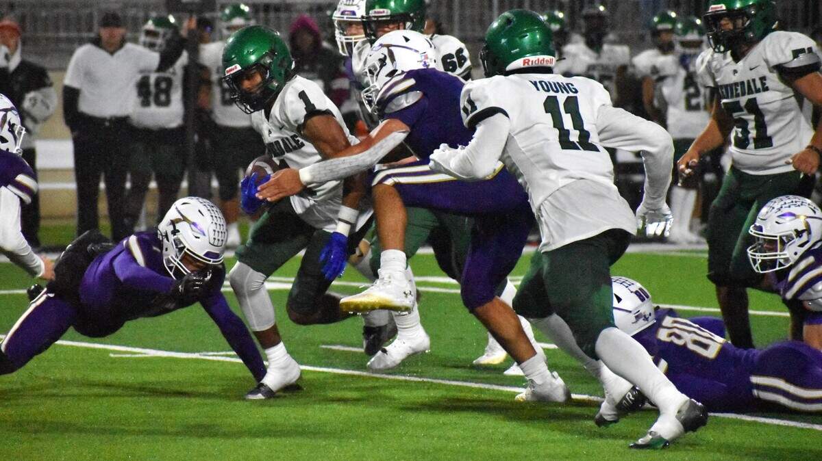 Kenendale running back Laurrence Watkins breaks through the Alvarado defensive line for a first down in the third quarter of Thursday’s game in Crowley.