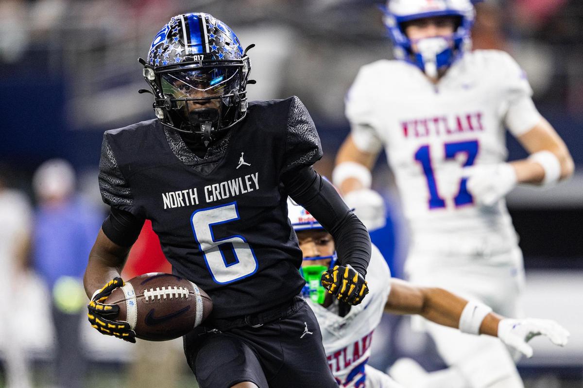 North Crowley wide receiver Quentin Gibson (6) runs past the Westlake defense to score a long touchdown on the first offensive play of the game in the first quarter of the UIL 6A Division I championship game at AT&T Stadium in Arlington on Saturday, Dec. 21, 2024.
