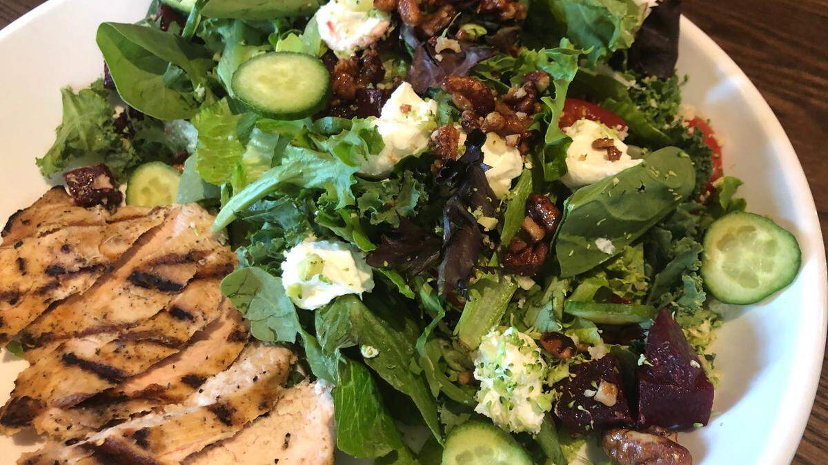 A grilled chicken salad at HG Sply Co. Trophy Club includes beets, cucumber, riced broccoli and cauliflower, grapes, candied pecans and dried cranberries.