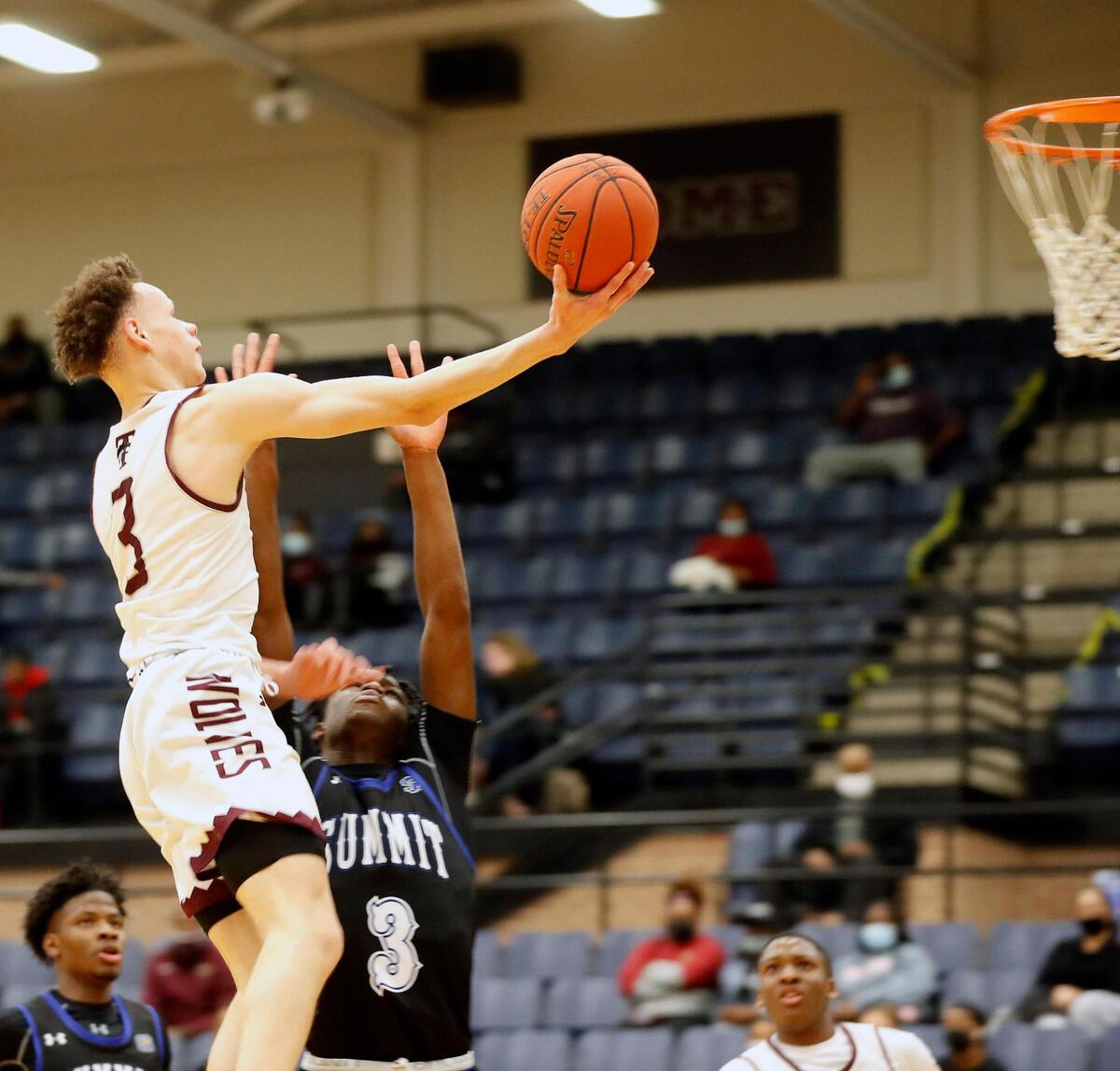 Timberview guard Chendall Weaver (3) lays one in over the defense of Summit guard Derrick Onyeador (3) during a high school basketball game at Timberview High School in Arlington, Texas, Tuesday, Jan. 05, 2021. Timberview led 27-20 at the half. (Special to the Star-Telegram Bob Booth)