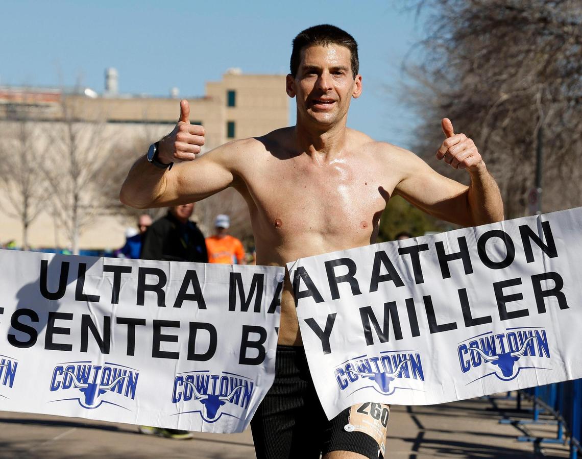 Scott Preston crosses the finish line of the 50K Ultra Marathon with a time of 03:21:13 during the 46th annual Cowtown Marathon at Will Rogers Complex in Fort Worth, on Sunday.
