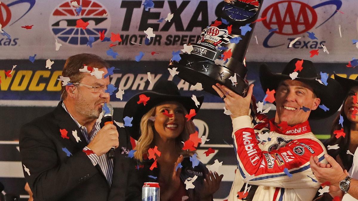 Kevin Harvick (4) hoists the trophy after winning the AAA Texas 500 NASCAR Monster Energy Cup Series at Texas Motor Speedway in Fort Worth, Texas, Sunday, Nov. 04, 2018. Kevin Harvick won the race to clinch a spot in the Cup championship field in two weeks.