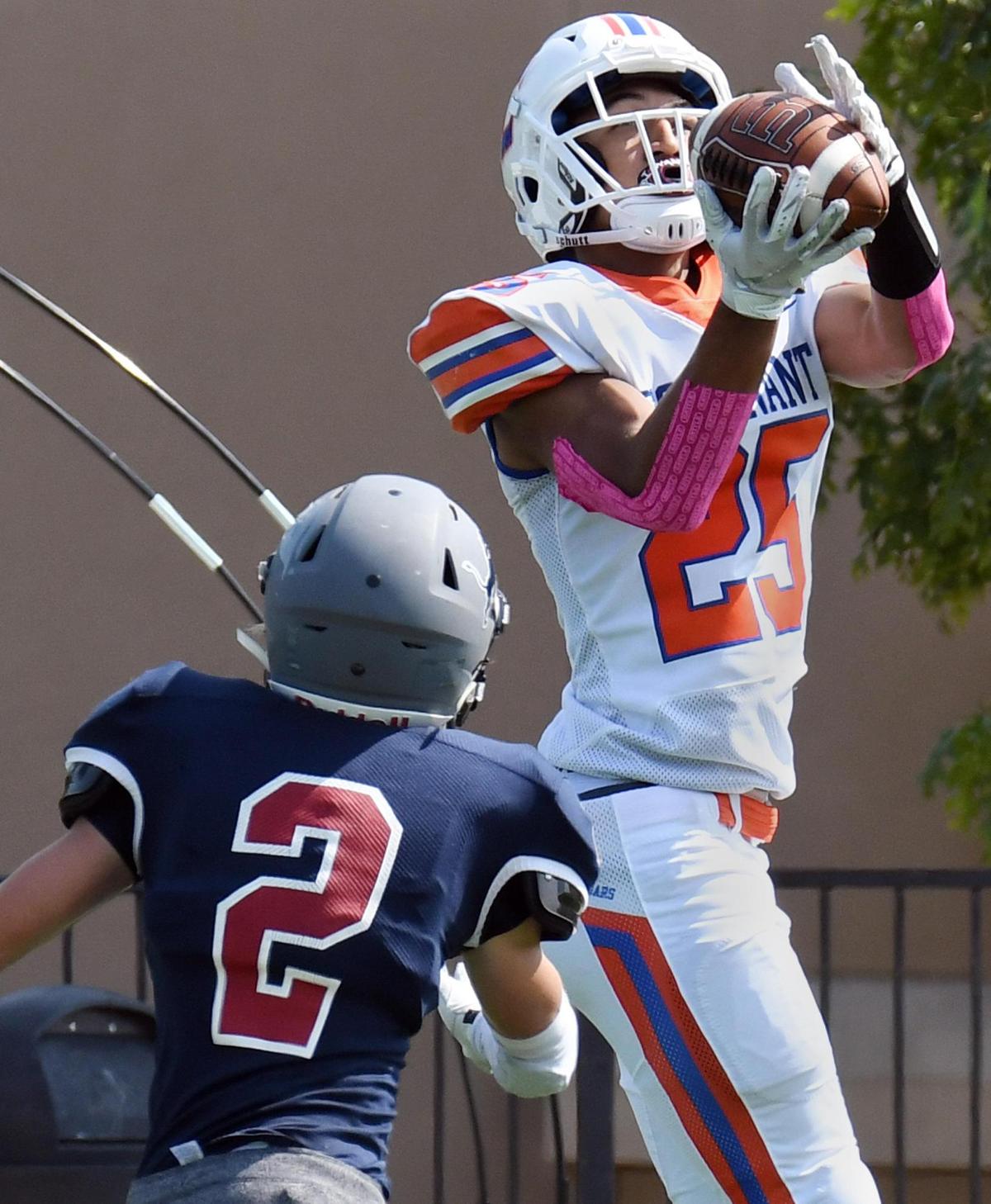 Colleyville Covenant’s Jayce Wells, right, brings in a catch for a first down as Lubbock Trinity’s Wesley Henderson defends during the third quarter of their TAPPS Division 3 District 1 football game Saturday, October 3, 2020 in Colleyville, Texas. Covenant won 21-20. Special/Bob Haynes