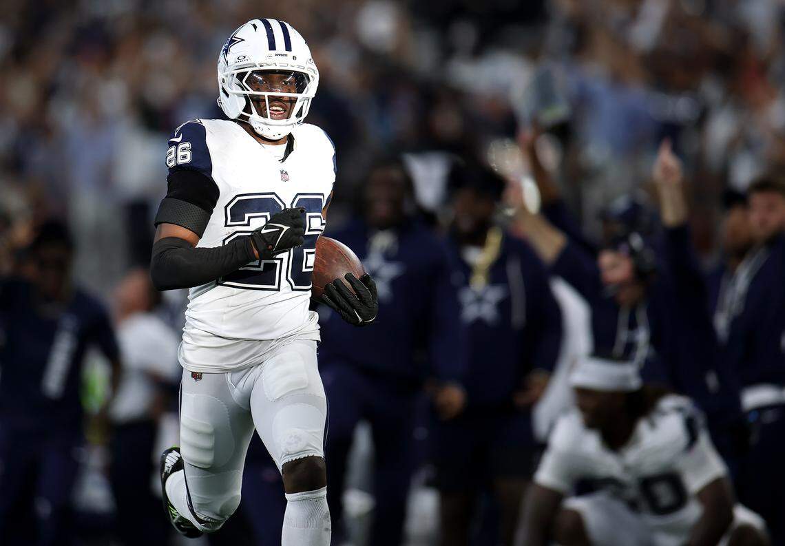 Dallas Cowboys cornerback DaRon Bland (26) returns an interception for a TD in a blowout win over Washington on Sunday in Arlington. Bland thrived while Trevon Diggs missed the game with a concussion.