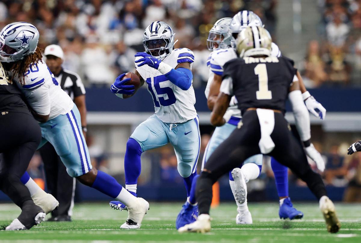 Dallas Cowboys running back Ezekiel Elliott runs the ball against the New Orleans Saints on Sunday, Sept. 15, 2024, at AT&T Stadium in Arlington.