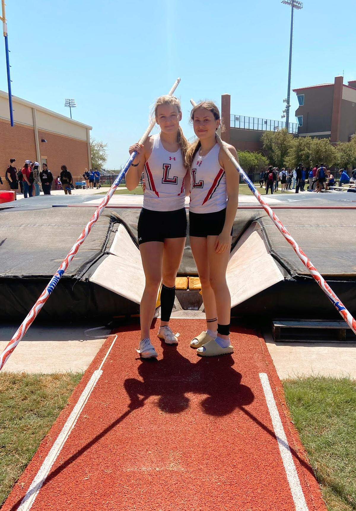Mansfield Legacy’s Ava Brimmage and Savannah Stewart clinched a regional berth after coming in first and second at the area pole vault championship (Sherrie Stewart/Courtesy)
