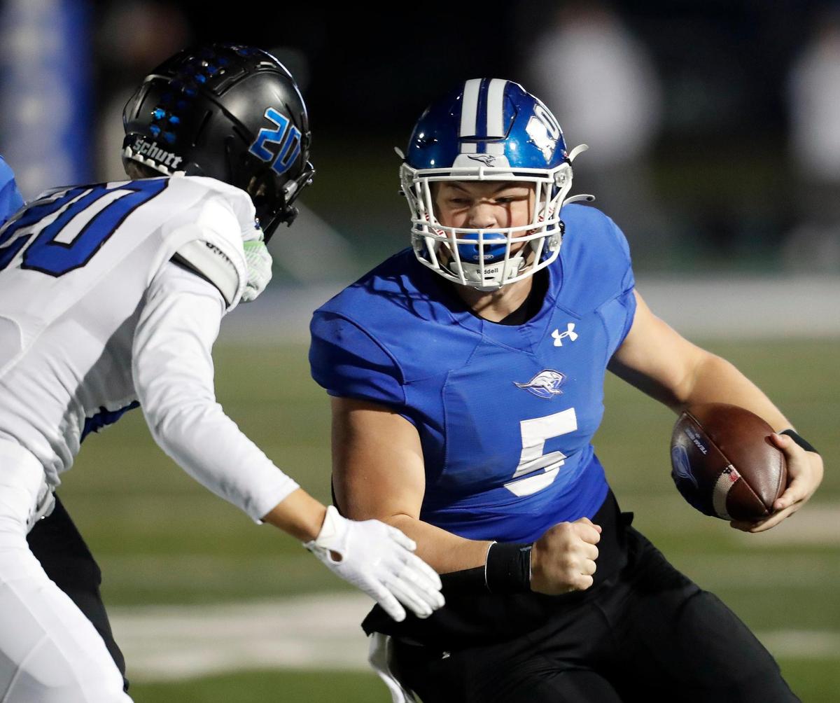 Weatherford quarterback Ryan Clark (5) rounds the left side of the line in a 6A Division 2 bi-district football playoff game at Kangaroo Stadium in Weatherford, Texas, Friday Nov. 12, 2021. Byron Nelson led 21-7 at the half. (Special to the Star-Telegram Bob Booth)