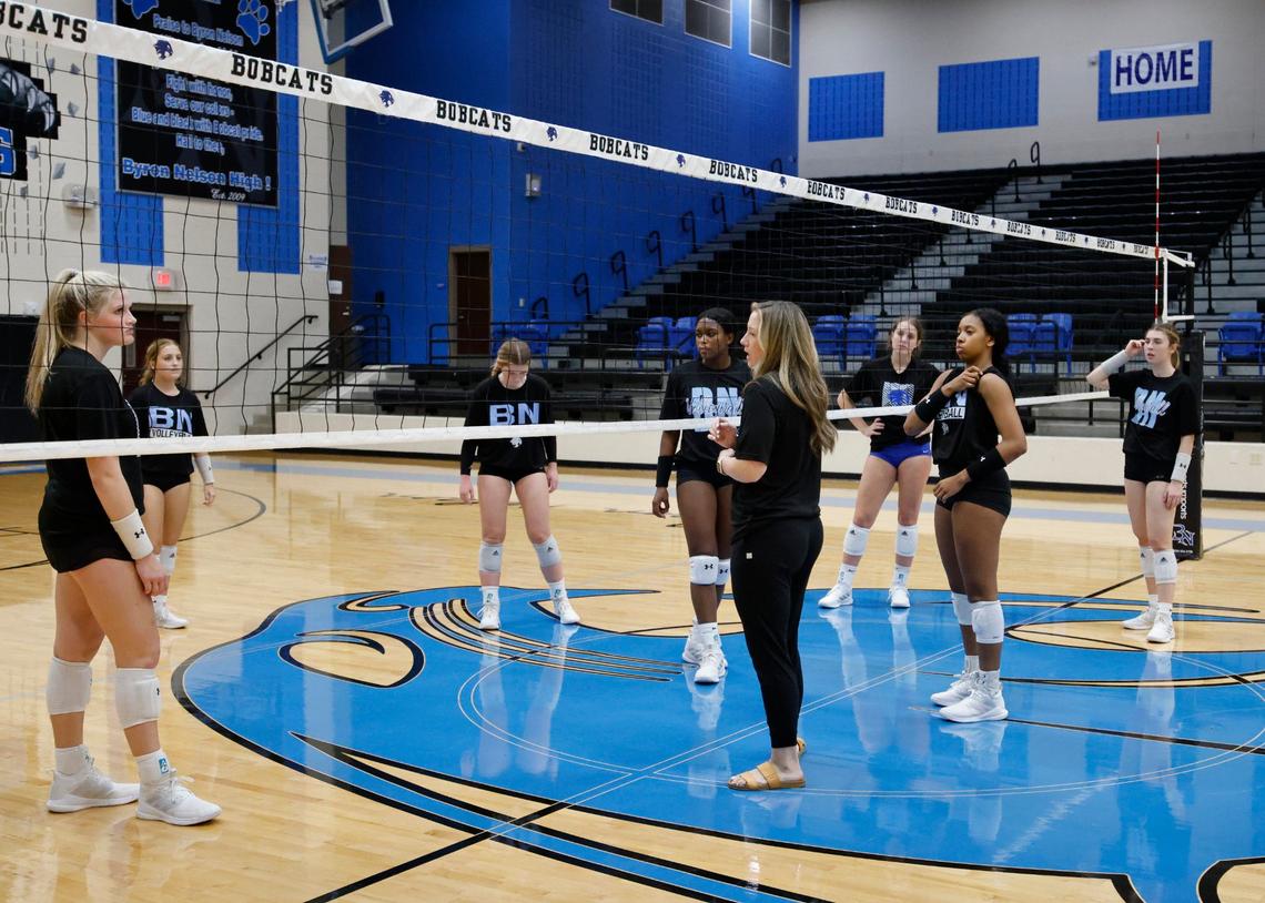 Head coach, Brianne Barker Groth talks with players during volleyball practice at Byron Nelson High School in Trophy Club Texas, Wednesday, Sept. 25, 2024.