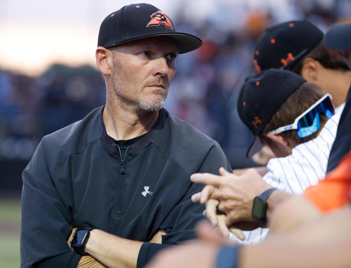 Aledo head coach Chad Barry talks to players in the dugout during a UIL Area Round 5AD1 baseball playoff game at Bearcat Field in Aledo, Texas, on May 08, 2025.