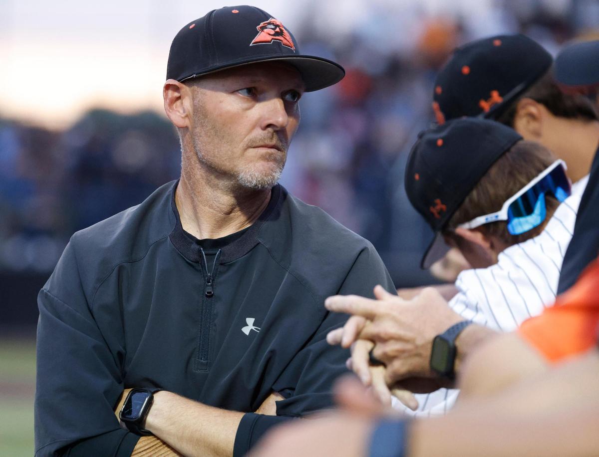 Aledo head coach Chad Barry talks to players in the dugout during a UIL Area Round 5AD1 baseball playoff game at Bearcat Field in Aledo, Texas, Thursday, May 08, 2025.