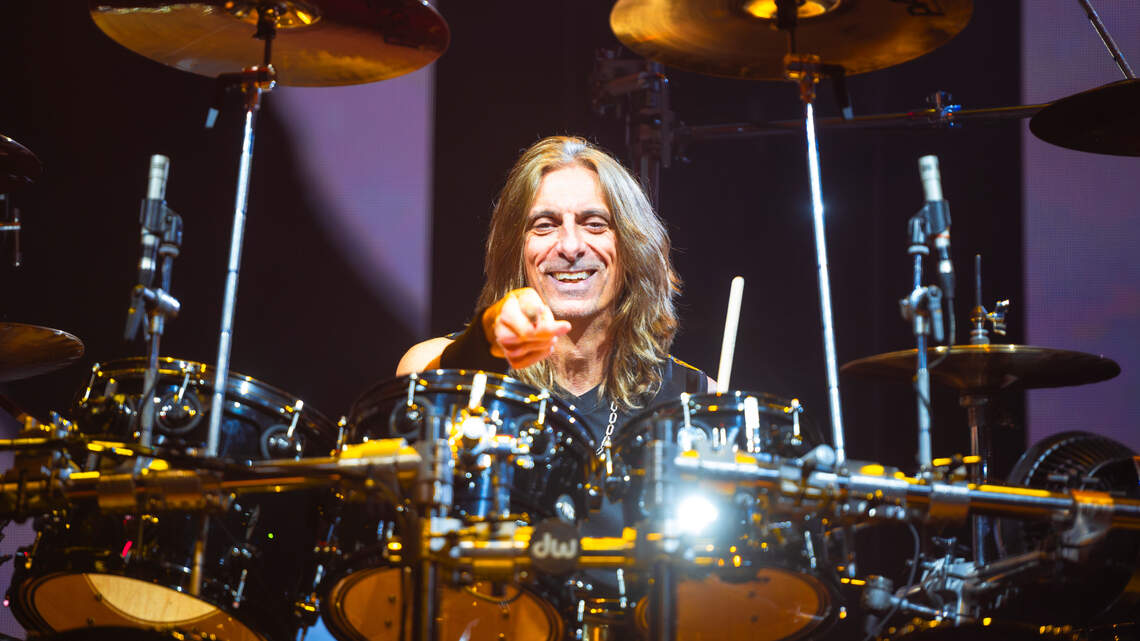 A 15-year-old girl interviews Judas Priest drummer Scott Travis