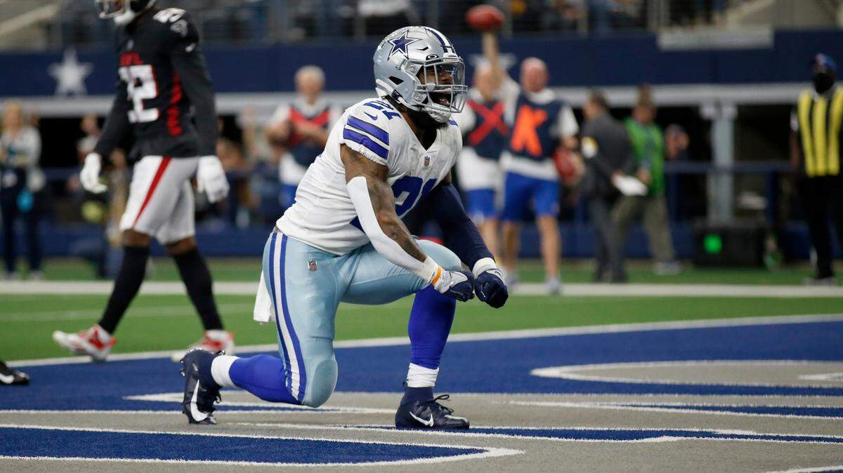 Dallas Cowboys running back Ezekiel Elliott celebrates in the end zone after a touchdown Sunday against the Atlanta Falcons at AT&T Stadium. The Cowboys led 36-3 at the half.