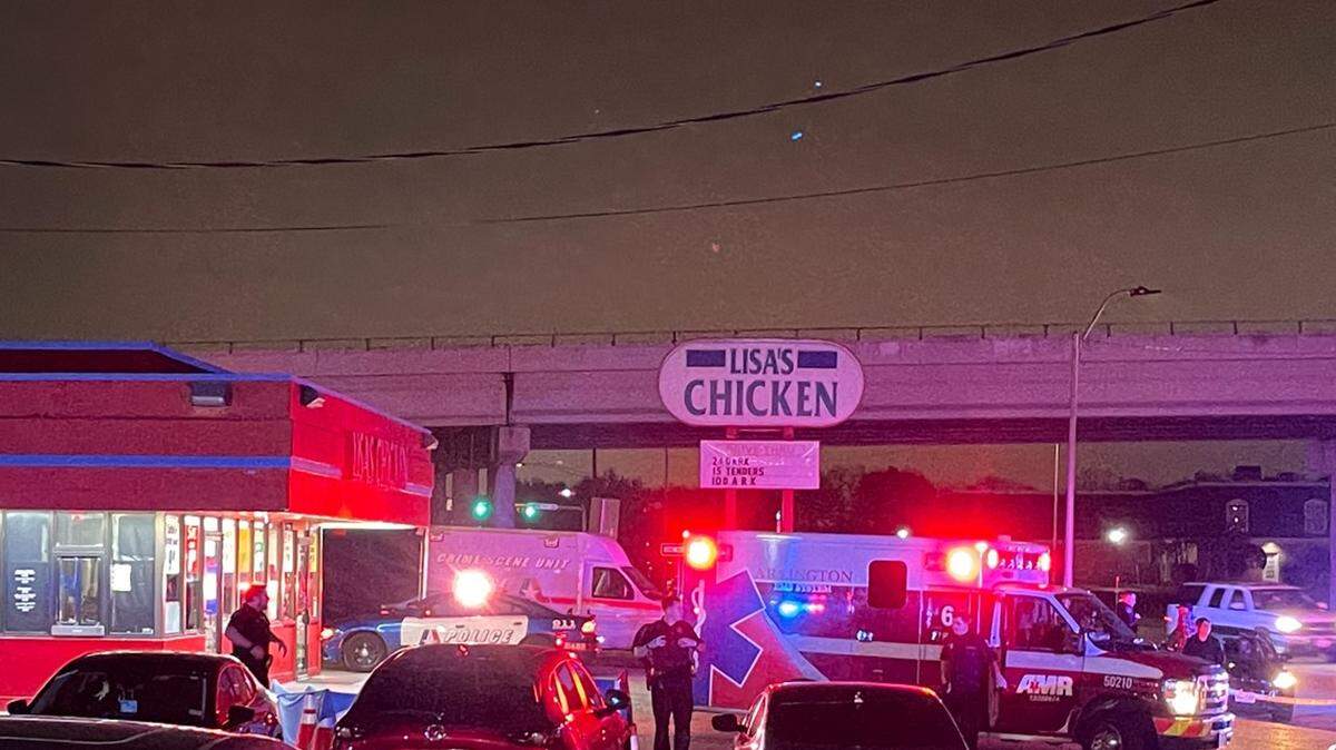 A man was killed in a shooting Monday afternoon in a restaurant parking lot on West Division Street in Arlington, according to police. Two women have been arrested.