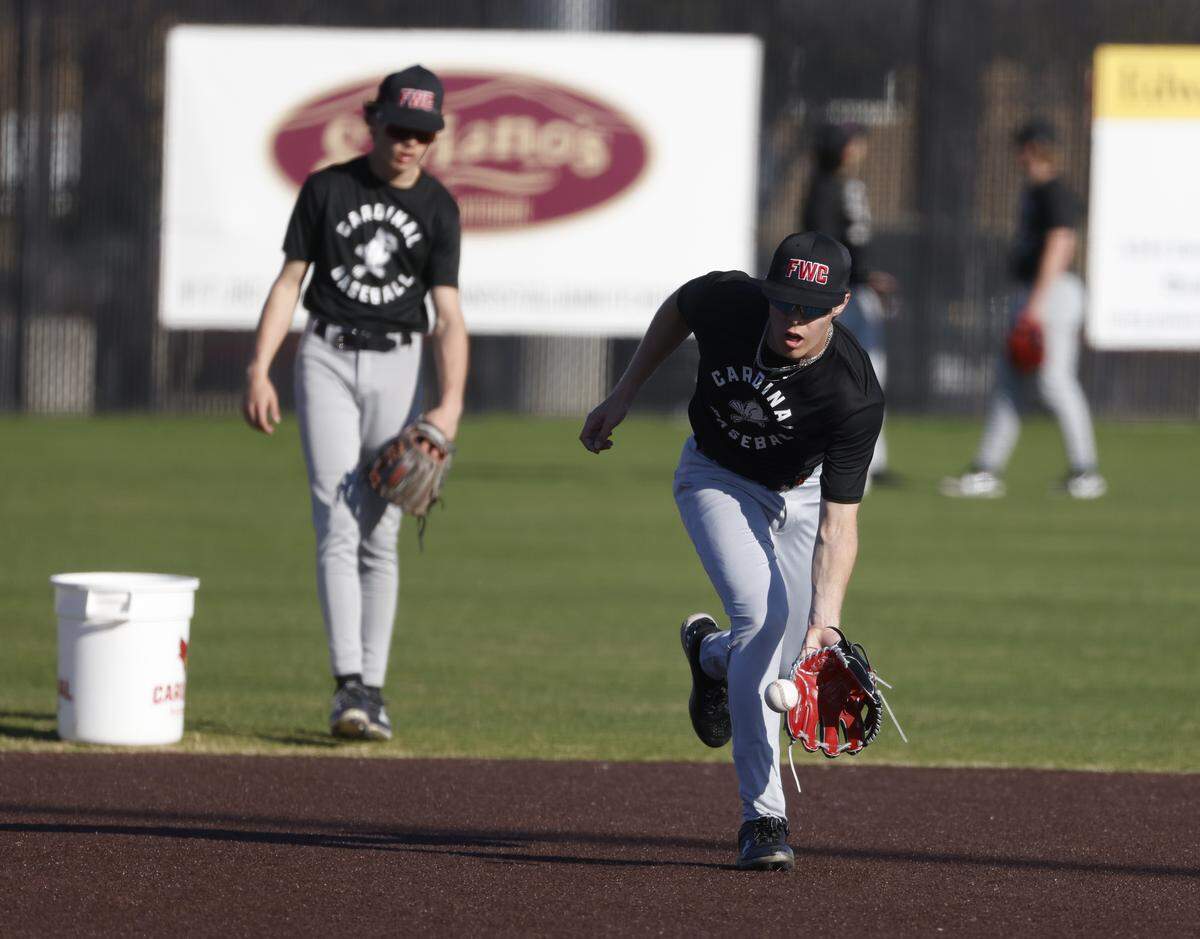 Fort Worth Christian short stop Grady Emerson picks up an infield grounder during baseball practice at Fort Worth Christian School in North Richland Hills, Texas, Monday, Feb. 23, 2026.