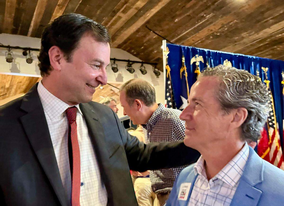 State Rep. ⁦‪Craig Goldman left, is greeted by Sen. Kelly ⁦Hancock‬⁩ at Goldman’s victory party at Courtside Kitchen in Fort Worth on Tuesday, May 28, 2024. Goldman opened a wide lead over banker John O’Shea.