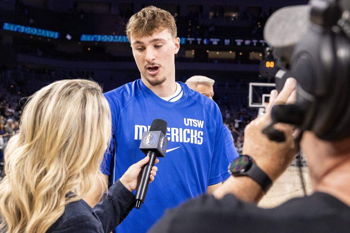 Mavericks forward Cooper Flagg (32) is interviewed following the second half of a preseason NBA game between the Dallas Mavericks and Oklahoma City Thunder at Dickies Arena in Fort Worth on Monday, Oct. 6, 2025.