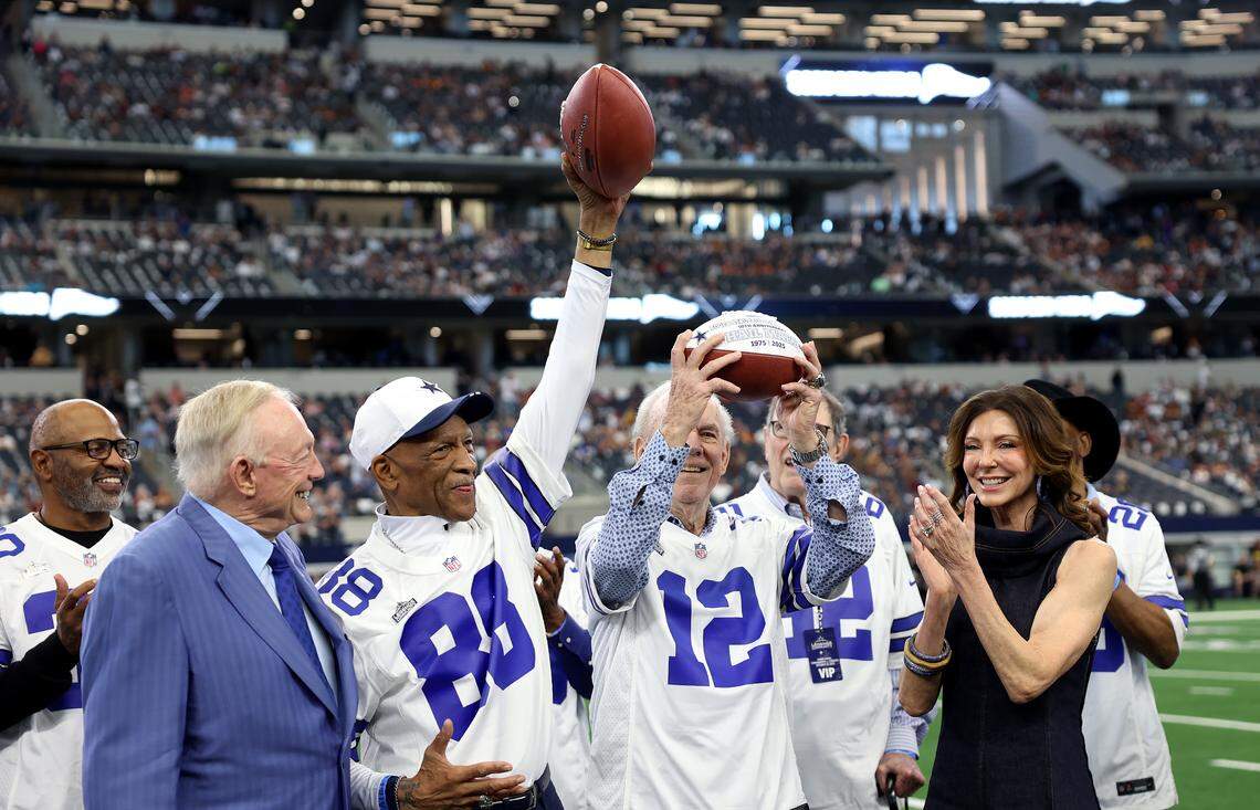 Dallas Cowboys legends Drew Pearson, left, and Roger Staubach are honored at the 2025 homecoming game on Sunday at AT&T Stadium in Arlington. 