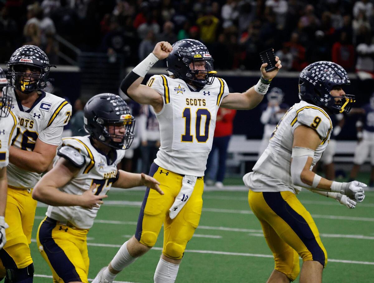 Highland Park quarterback Anderson Jackson (10) carries the kicking tee off the field after kicker Sutton Stock (73) made the winning kick during the UIL 5A D1 Semifinals football game at The Ford Center in Frisco, Texas, Friday, Dec. 13, 2024.