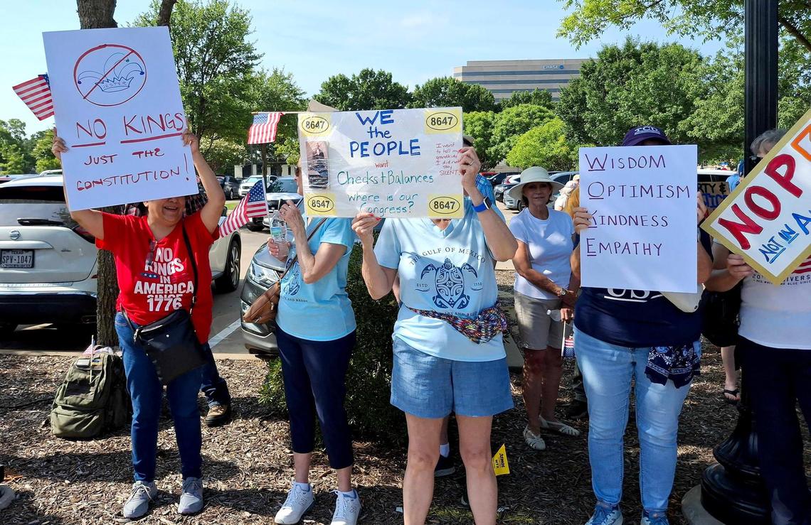 Protesters chant outside of Arlington Sub-Courthouse during the “No Kings Day” protest on June 14, 2025 in Arlington.