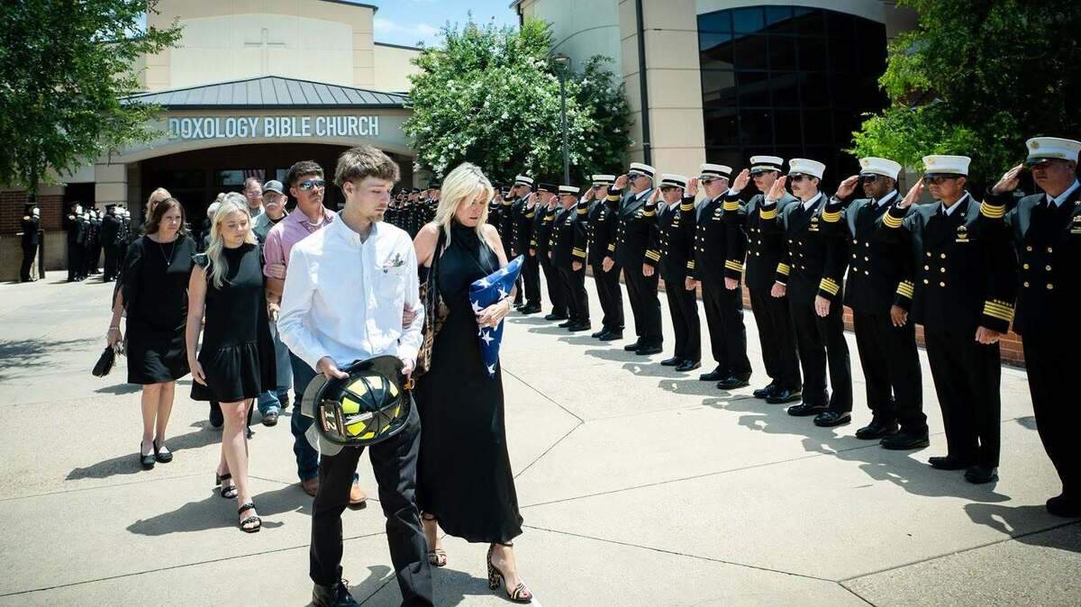 Fort Worth Firefighter Todd Brook’s family leaves the church after his memorial service on Wednesday, June 17, 2026.