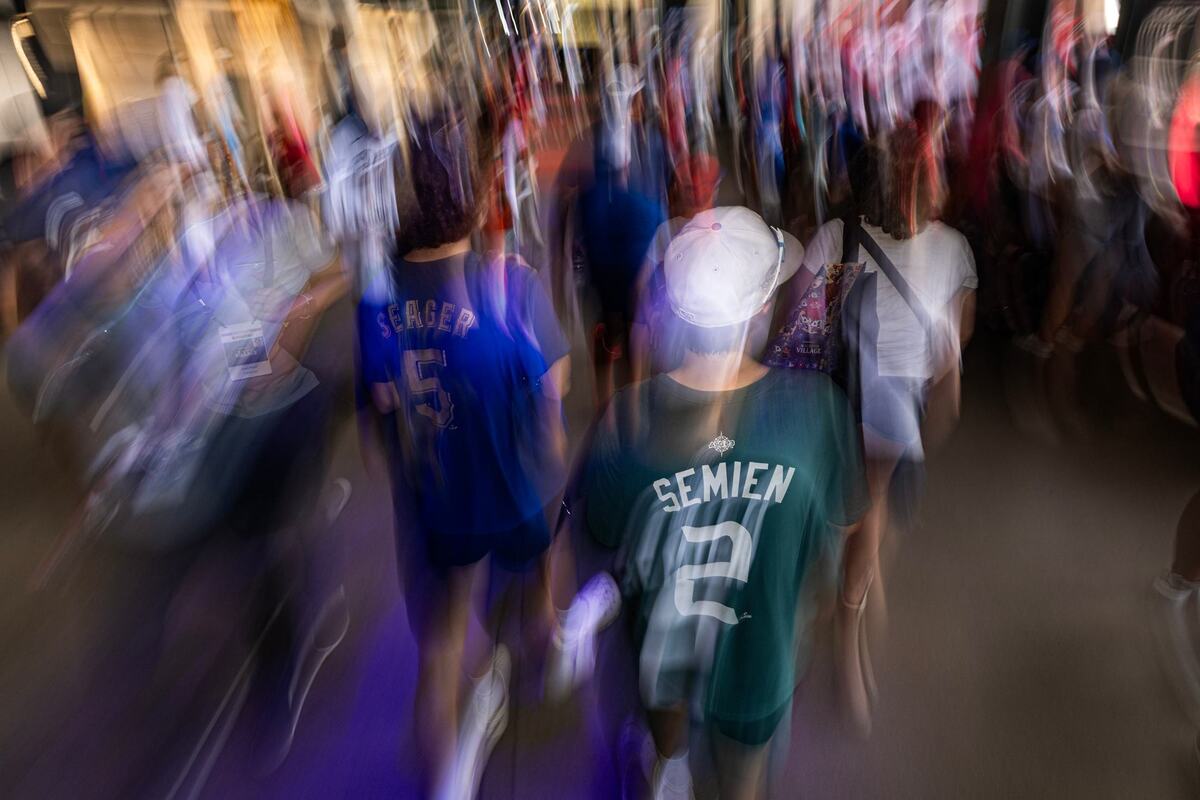Fans make their way through the crowd to see the different activities for the first day of the 2024 MLB All-Star Village at Choctaw Stadium in Arlington on Saturday, July 13, 2024.