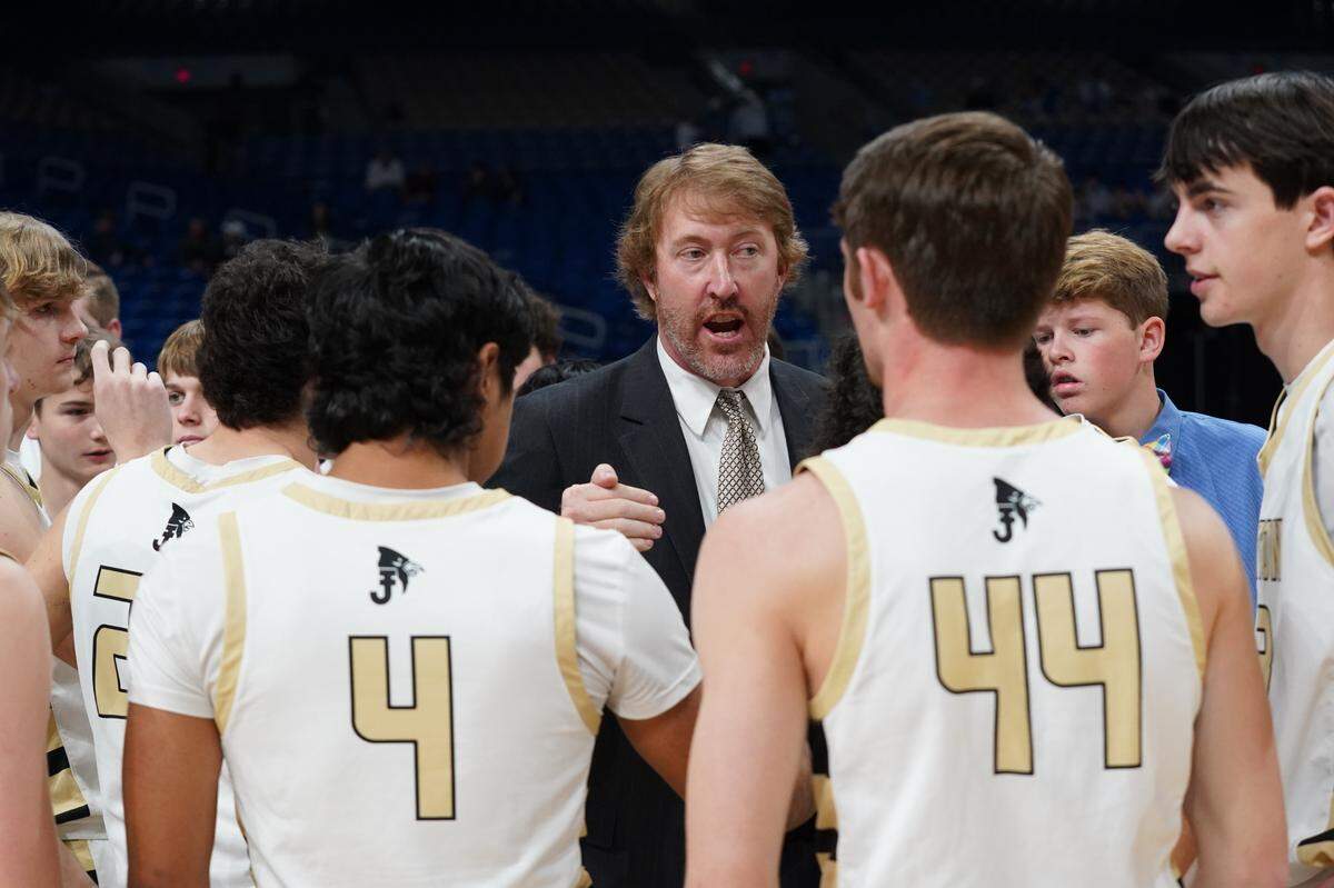 Jayton head coach Ryan Bleiker talks to his team during a time out against Fayetteville in a Class 1A state semifinal on Thursday, March 7, 2024 at the Alamodome in San Antonio, Texas. Jayton defeated Fayetteville 65-26.