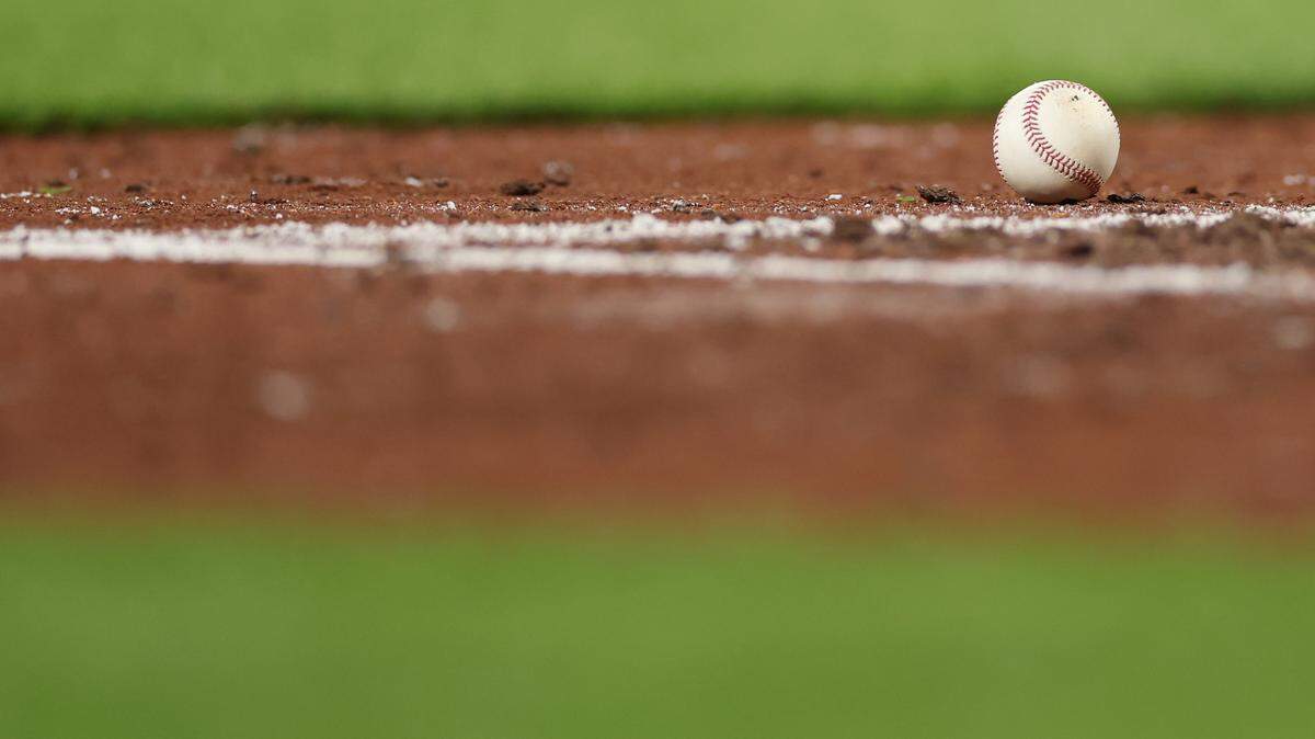 BALTIMORE, MARYLAND - APRIL 24: A detailed view of the infield grass and dirt and a baseball at Oriole Park at Camden Yards on April 24, 2026 in Baltimore, Maryland. (Photo by Patrick Smith/Getty Images)