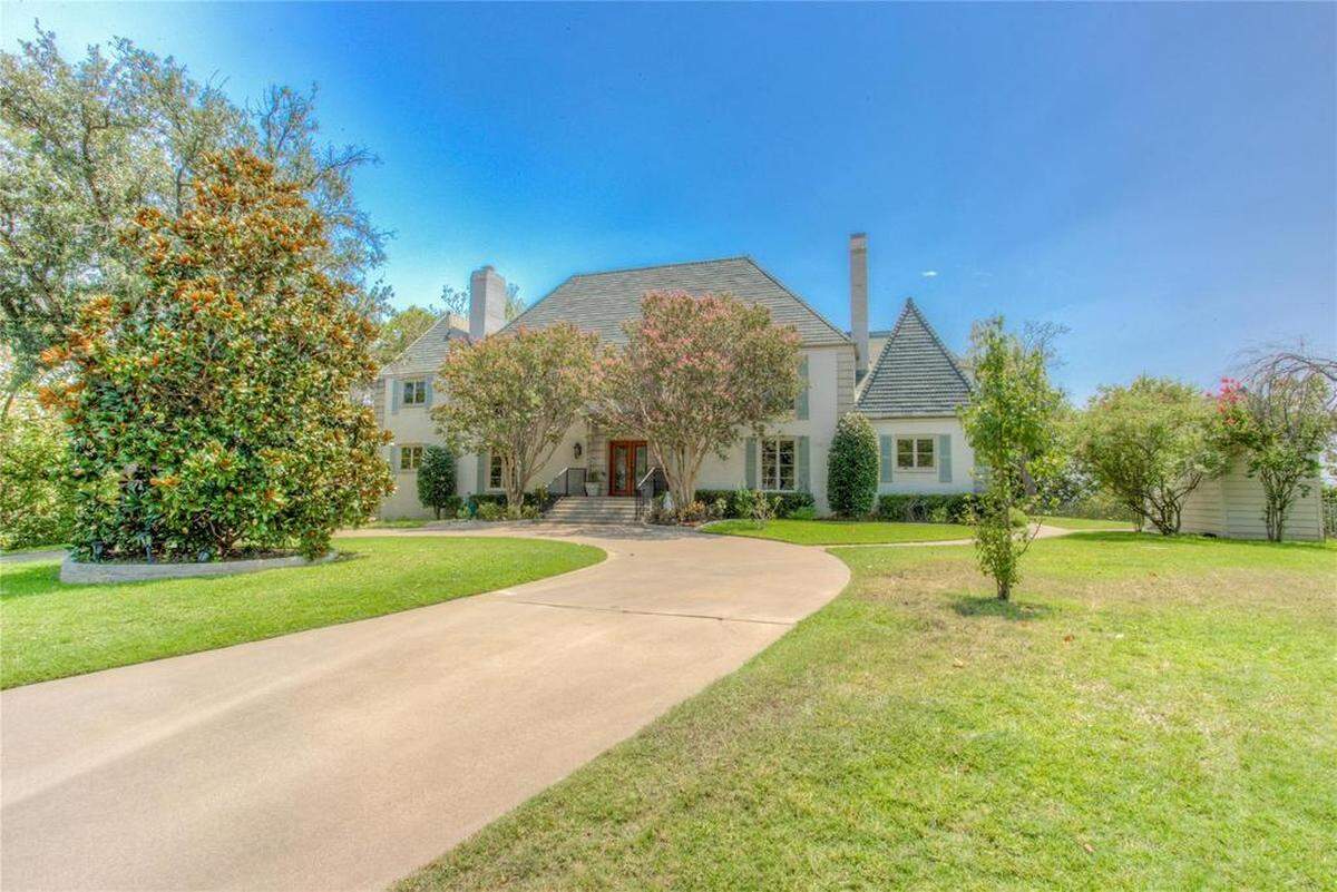6,432 sqaure foot French traditional style mansion located on Boat Club Road in Eagle Mountain Lake. Has to potential to be the most expensive home sale on the lake.