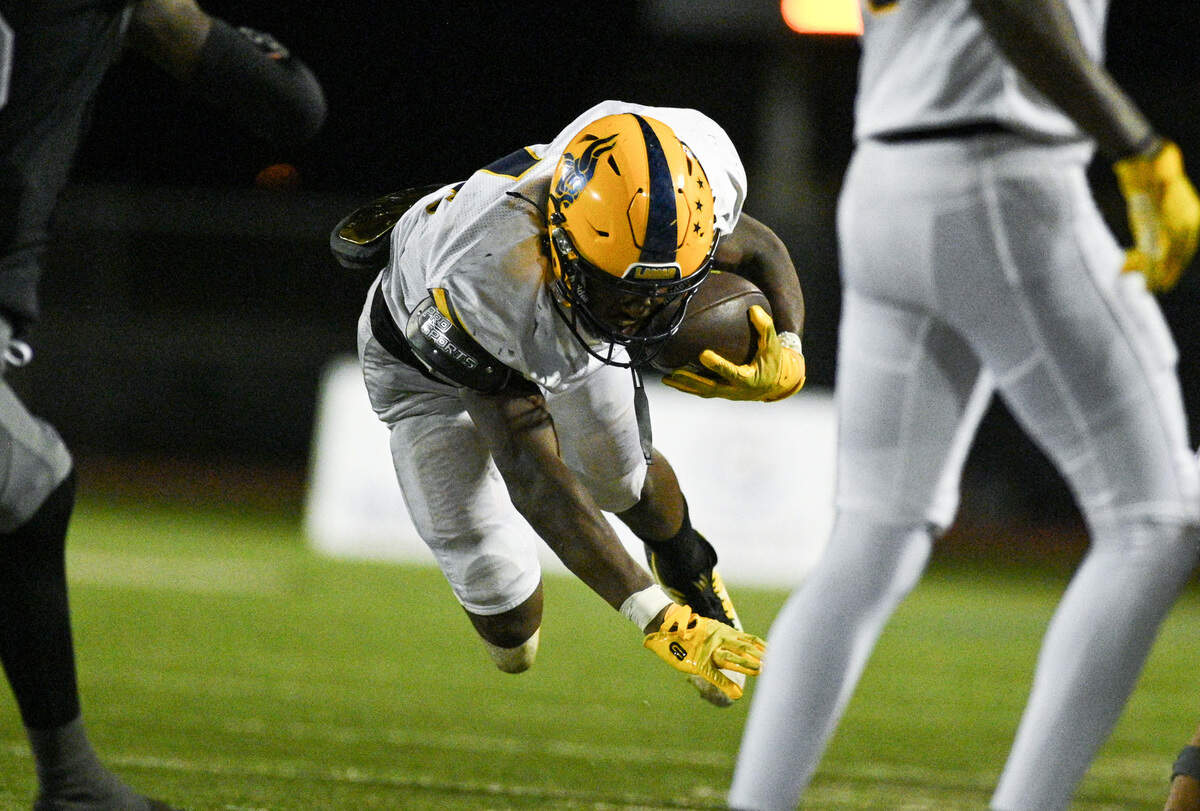 Lamar High School running back Kelton Barney (4) braces for a fall during a UIL football game against Martin High School at Cravens Field in Arlington, Texas on Friday, Sept. 20, 2024.